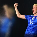 Women's soccer star kneels for national anthem