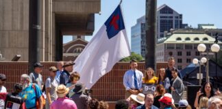 Camp Constitutions' Christian flag was hoisted over Boston City Hall