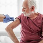 Elderly man gets vaccinated for COVID-19
