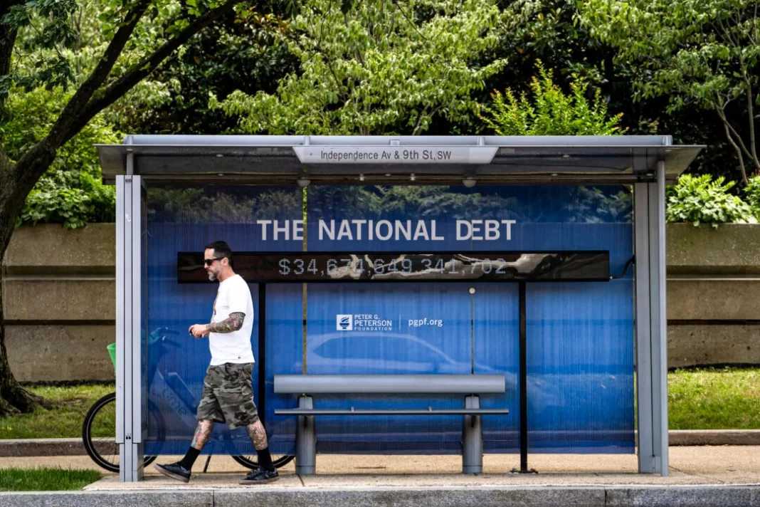 The National Debt Clock at a bus stop in Washington on June 10, 2024.