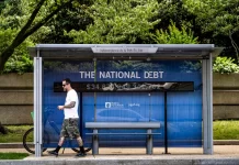 The National Debt Clock at a bus stop in Washington on June 10, 2024.