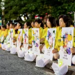 Falun Gong practitioners participate in a candlelight vigil