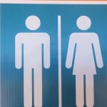 Symbols indicating male and female bathrooms are seen in Perth, Australia, on March 16, 2024.
