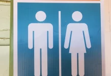 Symbols indicating male and female bathrooms are seen in Perth, Australia, on March 16, 2024.