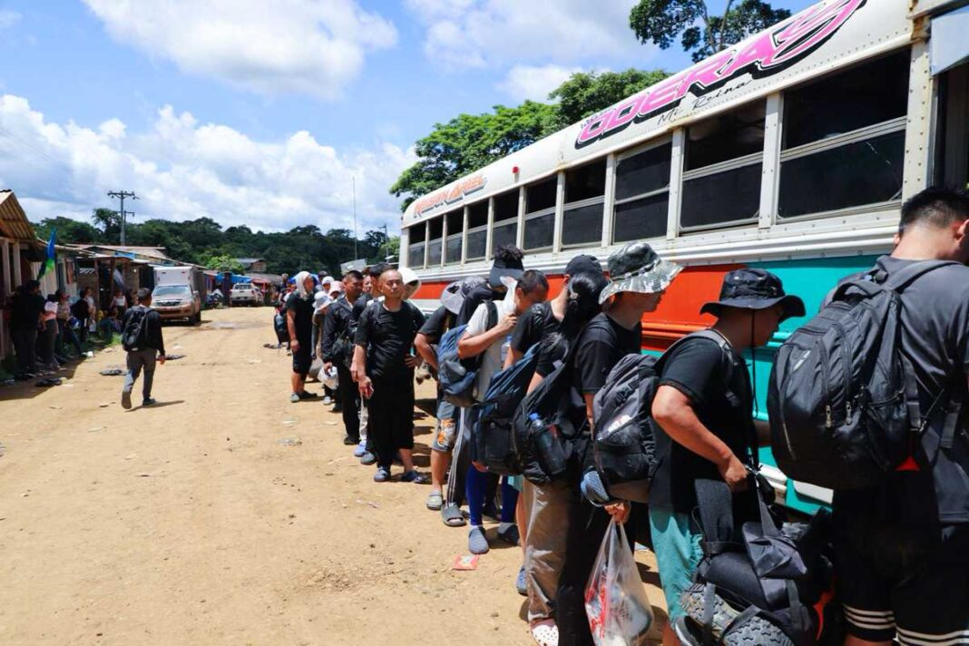 Chinese migrants at camp Canaán Membrillo in Panama load onto a bus in July 2024 for the next leg of their journey to cross the U.S. southern border illegally.