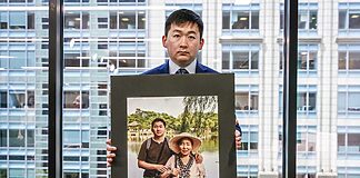 Simon Zhang and his mother, who was tortured to death in China,