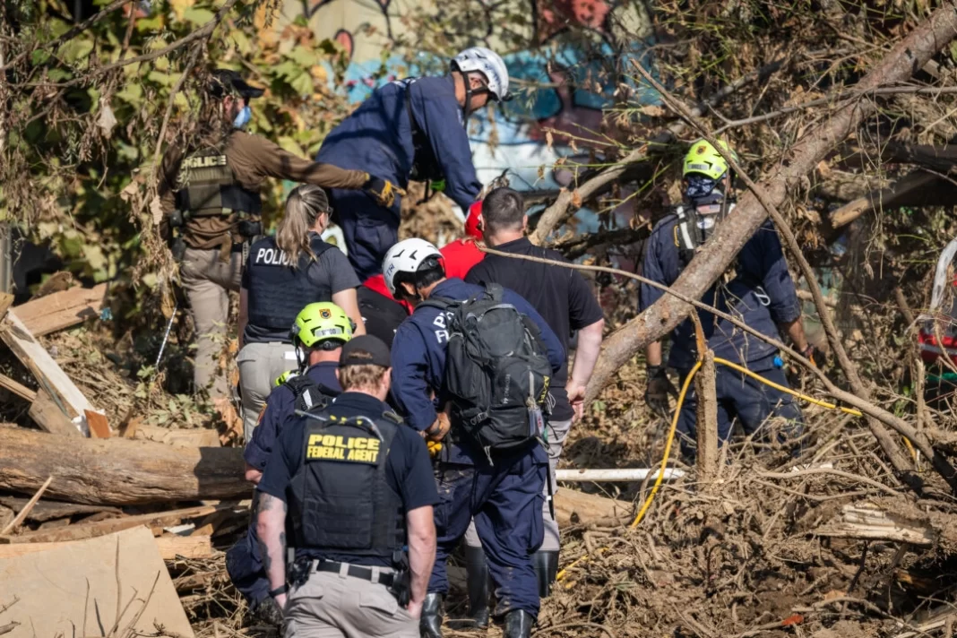 Rescue workers look for bodies following Hurricane Helene in Asheville, N.C., on Oct. 6, 2024.