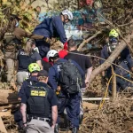 Rescue workers look for bodies following Hurricane Helene in Asheville, N.C., on Oct. 6, 2024.