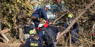 Rescue workers look for bodies following Hurricane Helene in Asheville, N.C., on Oct. 6, 2024.