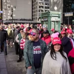 People wait in line to enter a rally with former president Donald J. Trump in Madison Square Garden in New York City on Oct. 27, 2024.