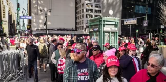 People wait in line to enter a rally with former president Donald J. Trump in Madison Square Garden in New York City on Oct. 27, 2024.