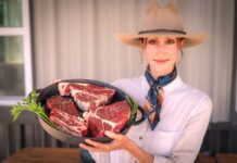 Avery Wrigglesworth shows a sample of Lily Hill Farm's Meat