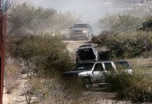 Mexican cartel members driving SUVs at Jacomba, Calif., border on Dec. 6, 2023.