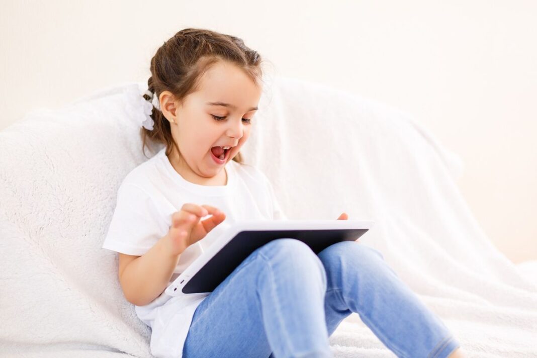 Child Playing on Tablet