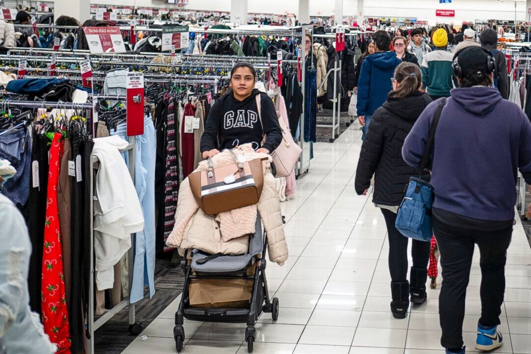 People shop on Black Friday at a mall in Hanover, Md