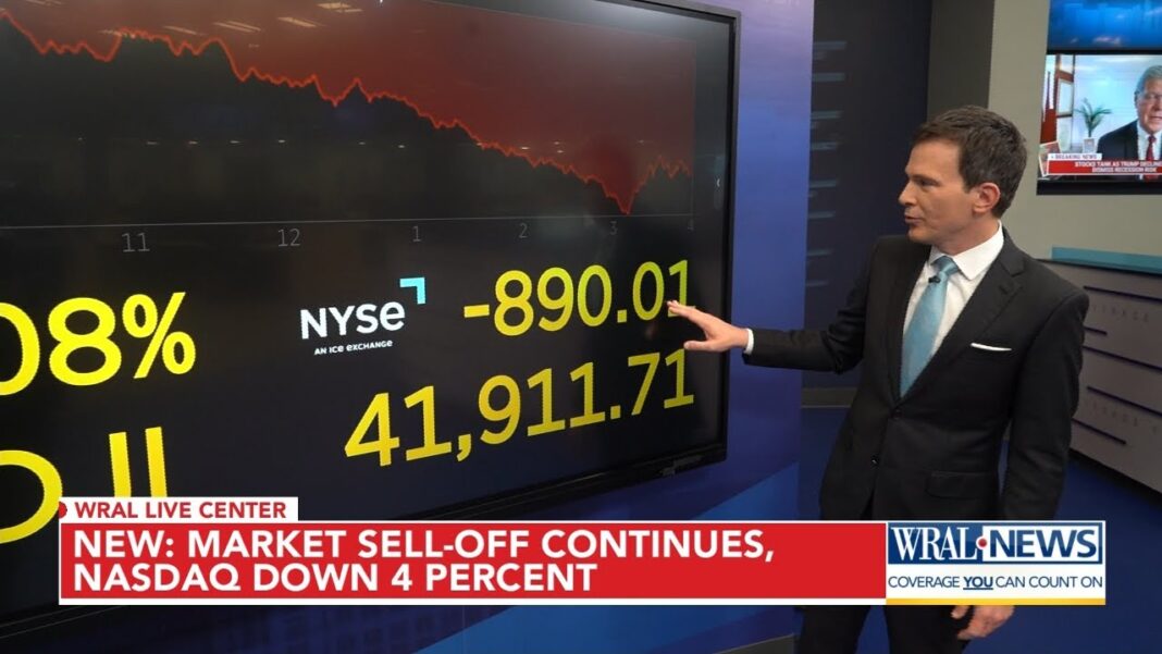 Dow falls by almost 900 points in market rout after Trump says he won't rule out a recession